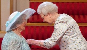 Maisie Ringham receiving the MBE from Her Majesty The Queen